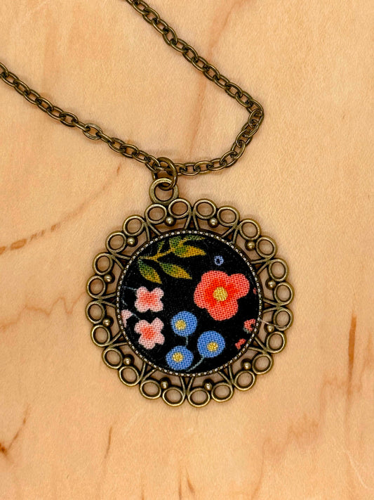 Small flowers on black Rifle Paper co flower fabric necklace