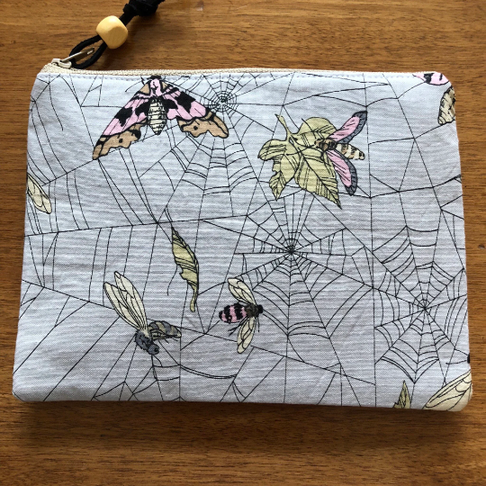 Moth and spiderwebs zippered pouch