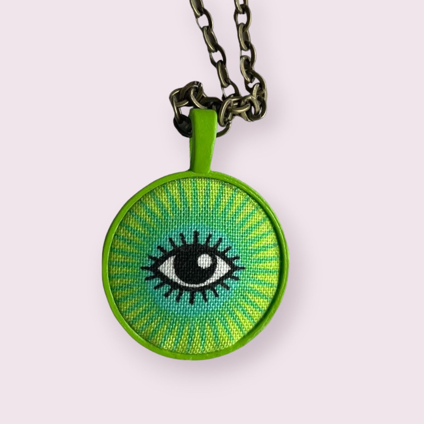 I see you lime green eye necklace